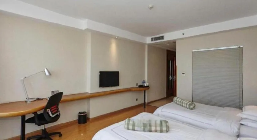 Bed in Warmly Hotel Suzhou Shuanghuwan