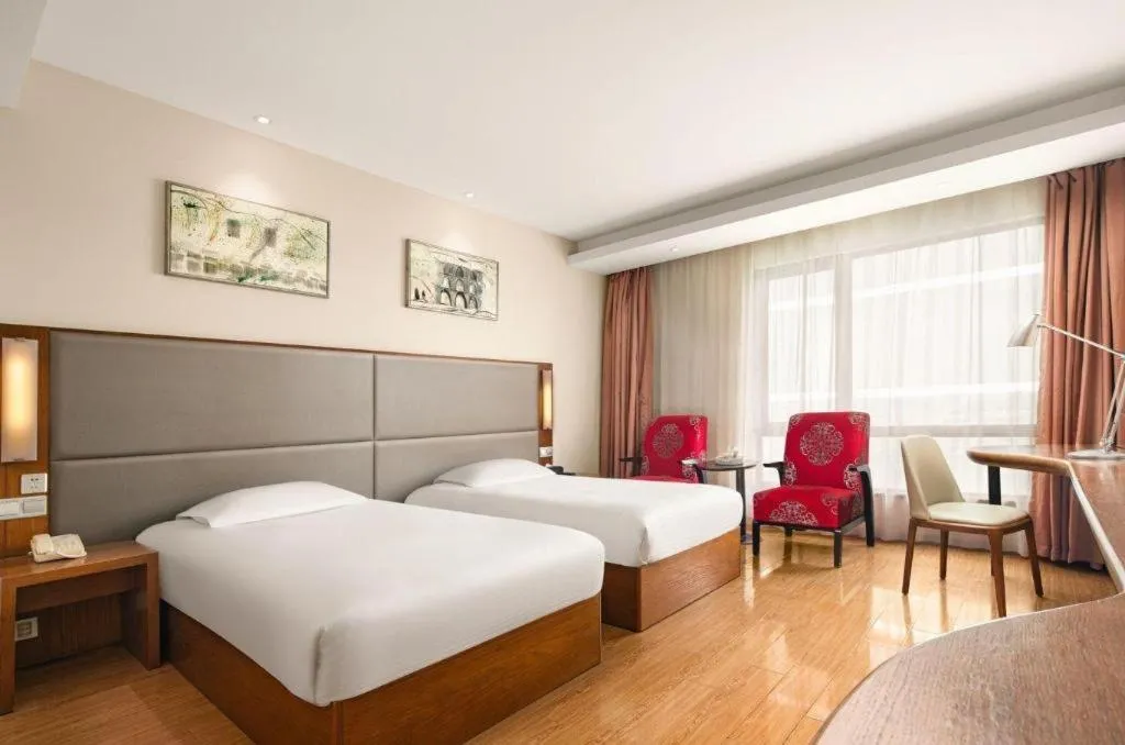 Bed in Warmly Hotel Suzhou Shuanghuwan