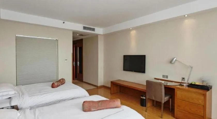 Bed in Warmly Hotel Suzhou Shuanghuwan