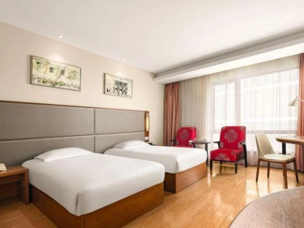 Bed in Warmly Hotel Suzhou Shuanghuwan