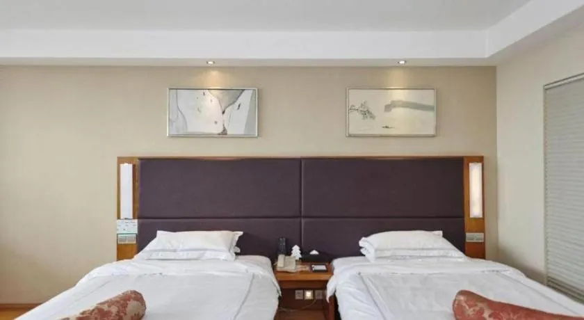 Bed in Warmly Hotel Suzhou Shuanghuwan