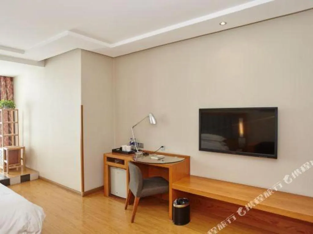 Bed in Warmly Hotel Suzhou Shuanghuwan