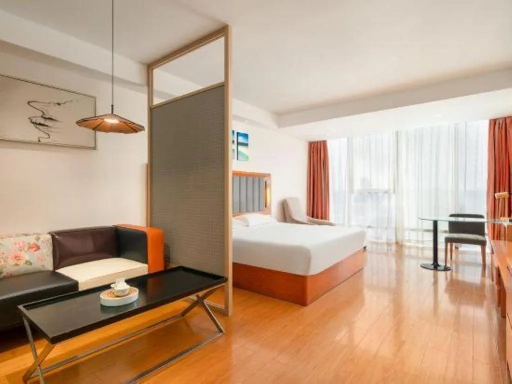 Bed in Warmly Hotel Suzhou Shuanghuwan