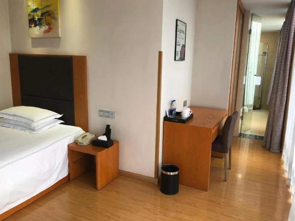 Bed in Warmly Hotel Suzhou Shuanghuwan