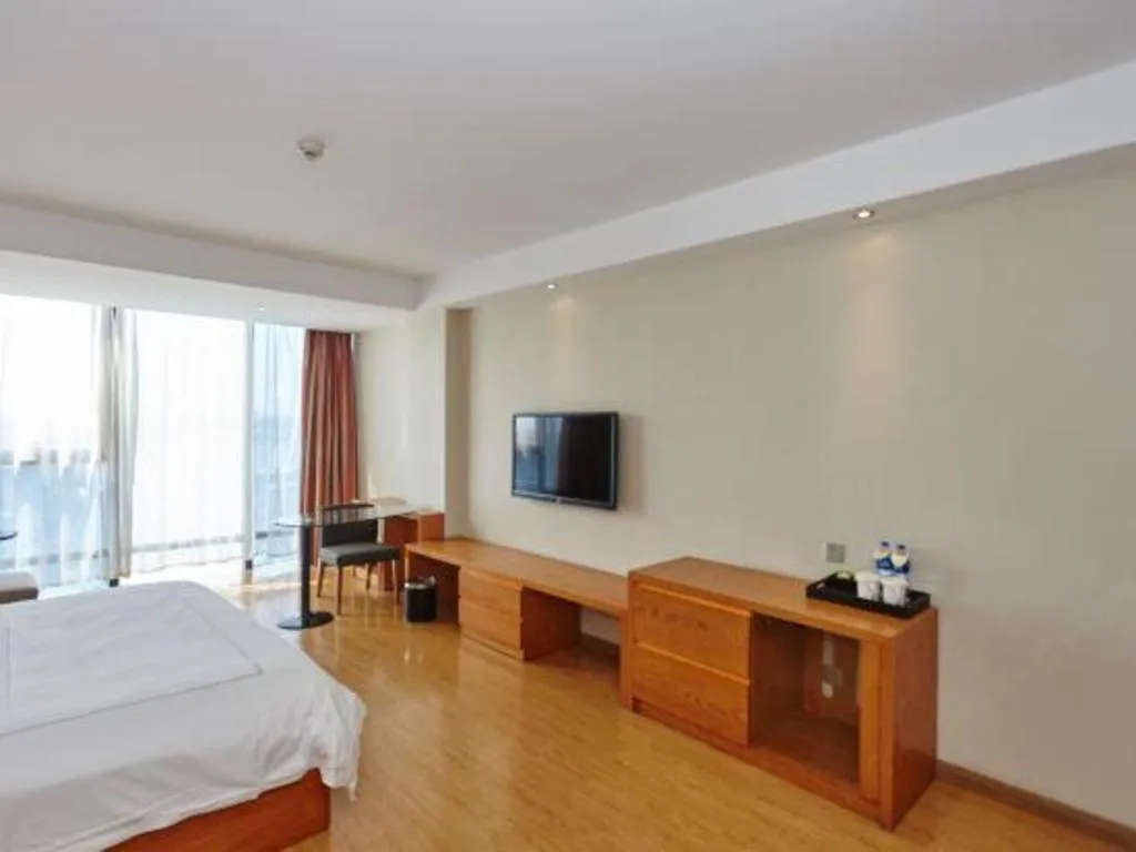 Bed in Warmly Hotel Suzhou Shuanghuwan