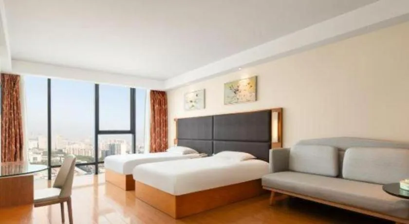 Bed in Warmly Hotel Suzhou Shuanghuwan