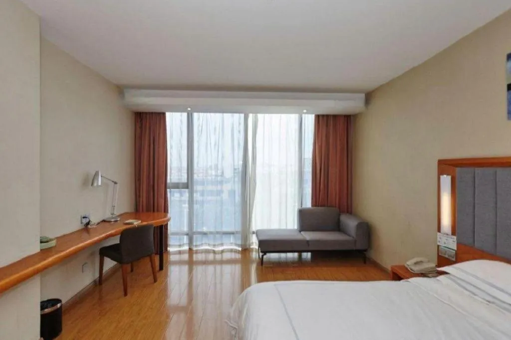 Bed in Warmly Hotel Suzhou Shuanghuwan