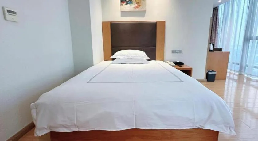 Bed in Warmly Hotel Suzhou Shuanghuwan