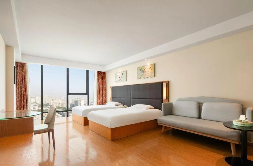 Bed in Warmly Hotel Suzhou Shuanghuwan