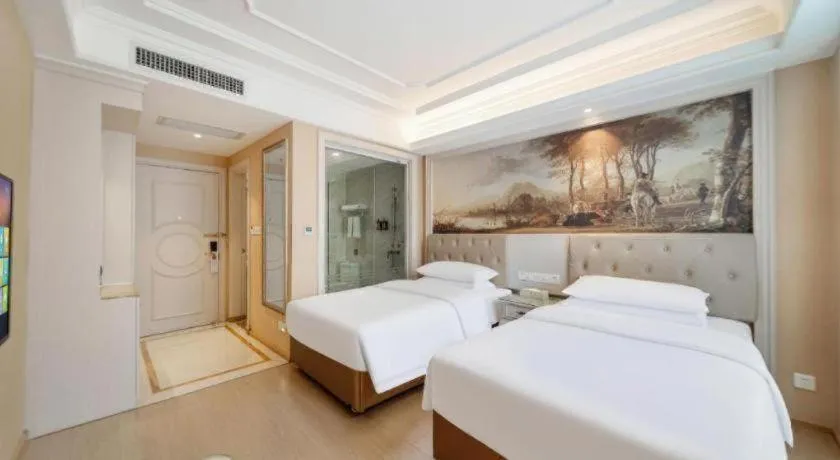 Bed in Vienna Hotel Guiyang Jiaxiulou Jichang Road