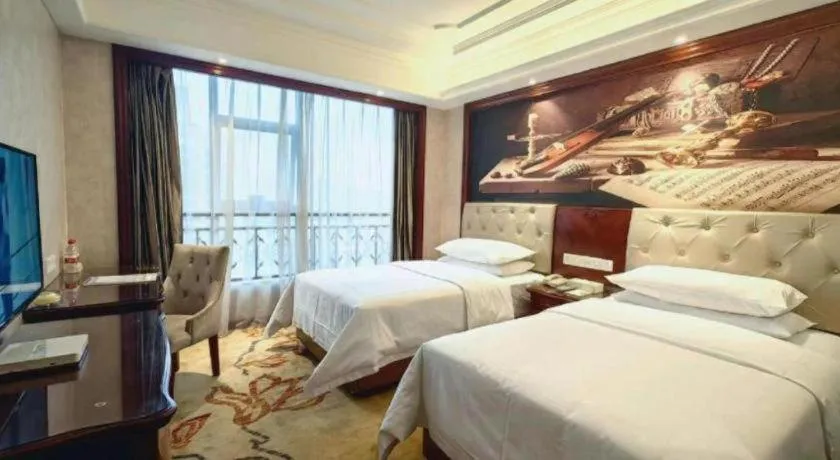 Bed in Vienna Hotel Guiyang Jiaxiulou Jichang Road