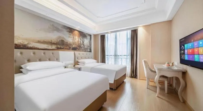 Bed in Vienna Hotel Guiyang Jiaxiulou Jichang Road