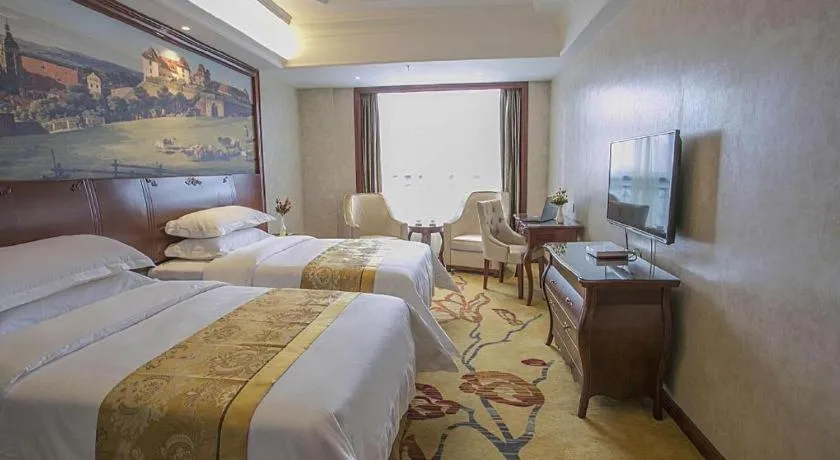 Bed in Vienna Hotel Guiyang Jiaxiulou Jichang Road