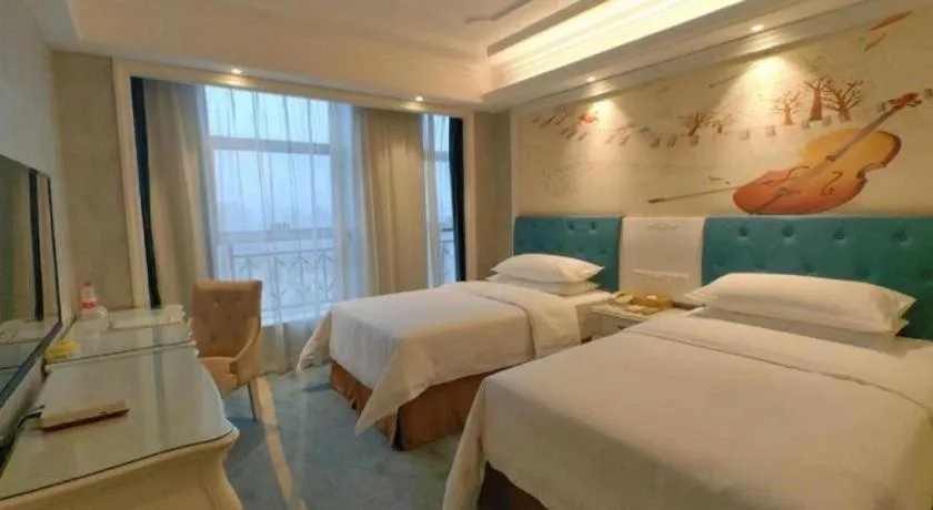Bed in Vienna Hotel Guiyang Jiaxiulou Jichang Road