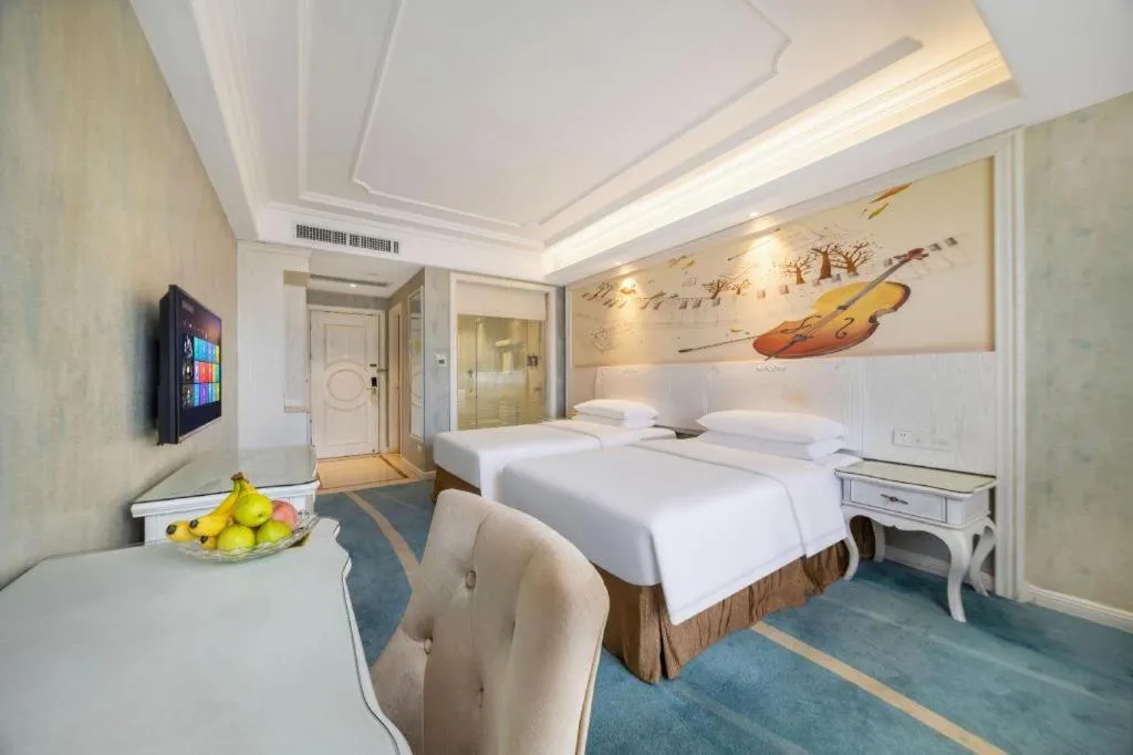 Bed in Vienna Hotel Guiyang Jiaxiulou Jichang Road