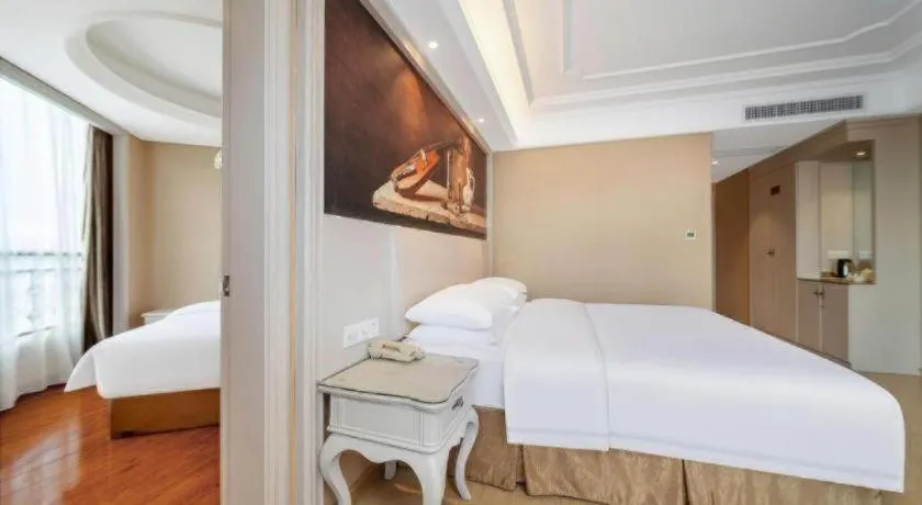 Bed in Vienna Hotel Guiyang Jiaxiulou Jichang Road