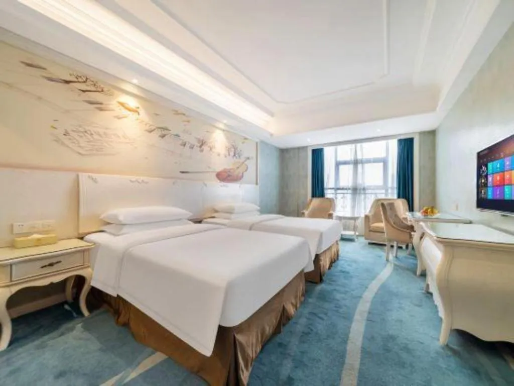 Bed in Vienna Hotel Guiyang Jiaxiulou Jichang Road