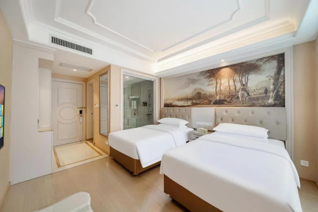 Bed in Vienna Hotel Guiyang Jiaxiulou Jichang Road