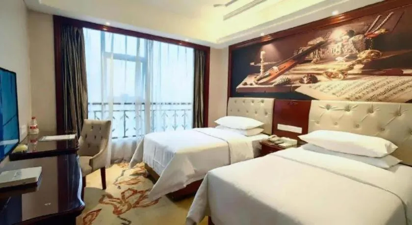 Bed in Vienna Hotel Guiyang Jiaxiulou Jichang Road