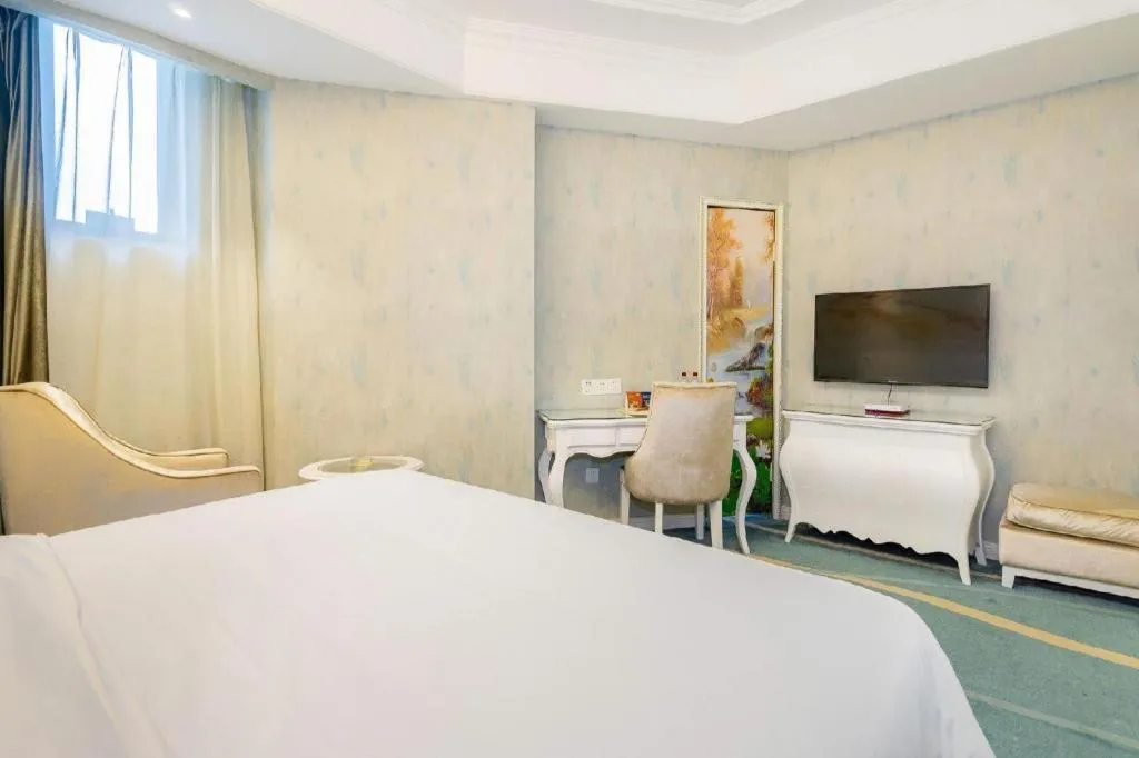 Bed in Vienna Hotel Guiyang Jiaxiulou Jichang Road