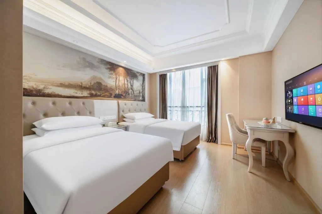 Bed in Vienna Hotel Guiyang Jiaxiulou Jichang Road