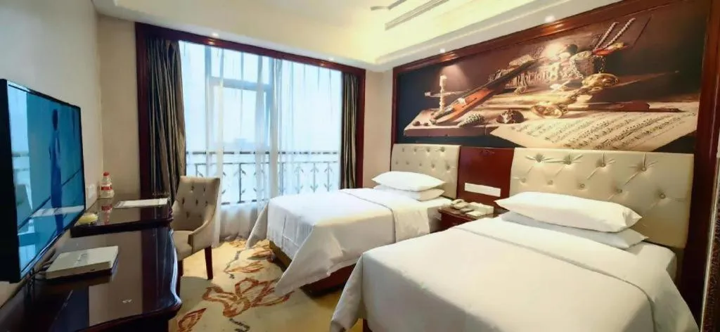 Bed in Vienna Hotel Guiyang Jiaxiulou Jichang Road