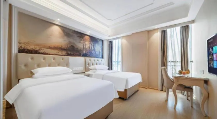 Bed in Vienna Hotel Guiyang Jiaxiulou Jichang Road