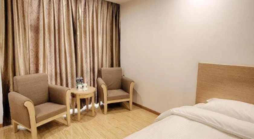 Bed in GreenTree Alliance Suzhou Zhangjiagang Nanfeng Town Hotel