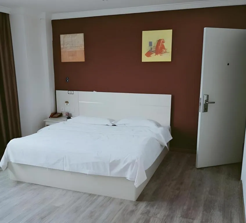 Bed in JUNYI Hotel Jiangxi Xinyu Baoshi Park