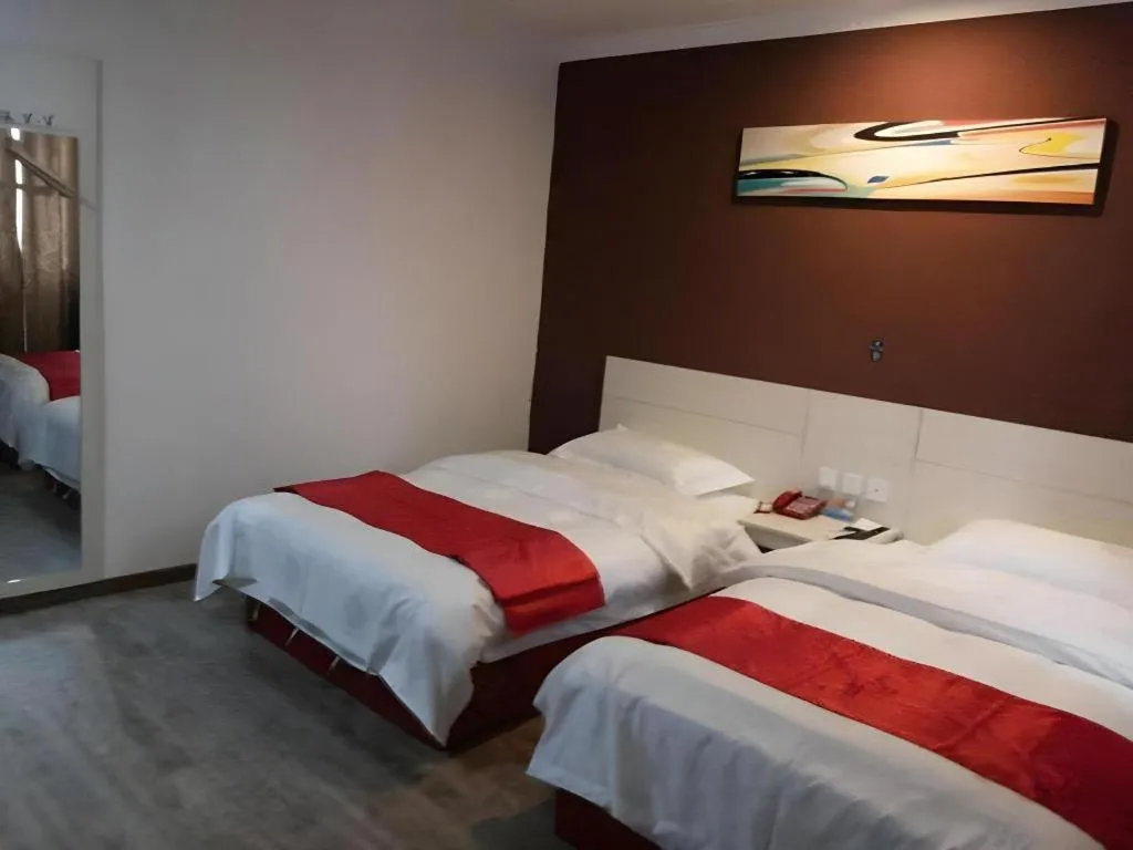 Bed in JUNYI Hotel Jiangxi Xinyu Baoshi Park