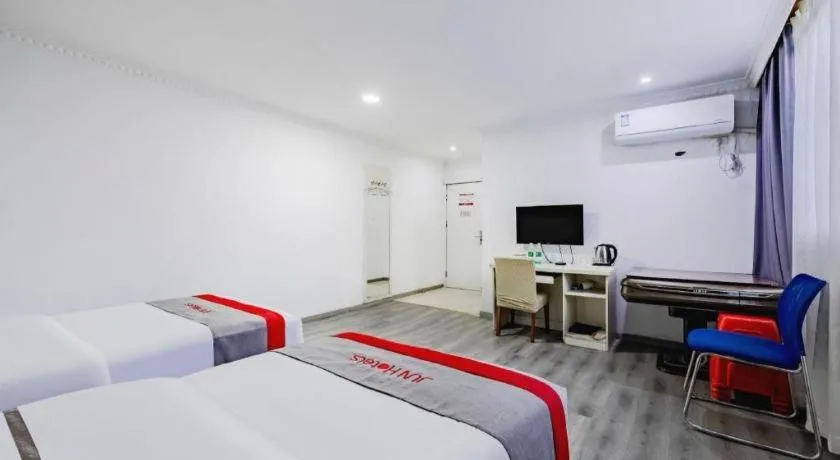 Bed in JUNYI Hotel Jiangxi Xinyu Baoshi Park