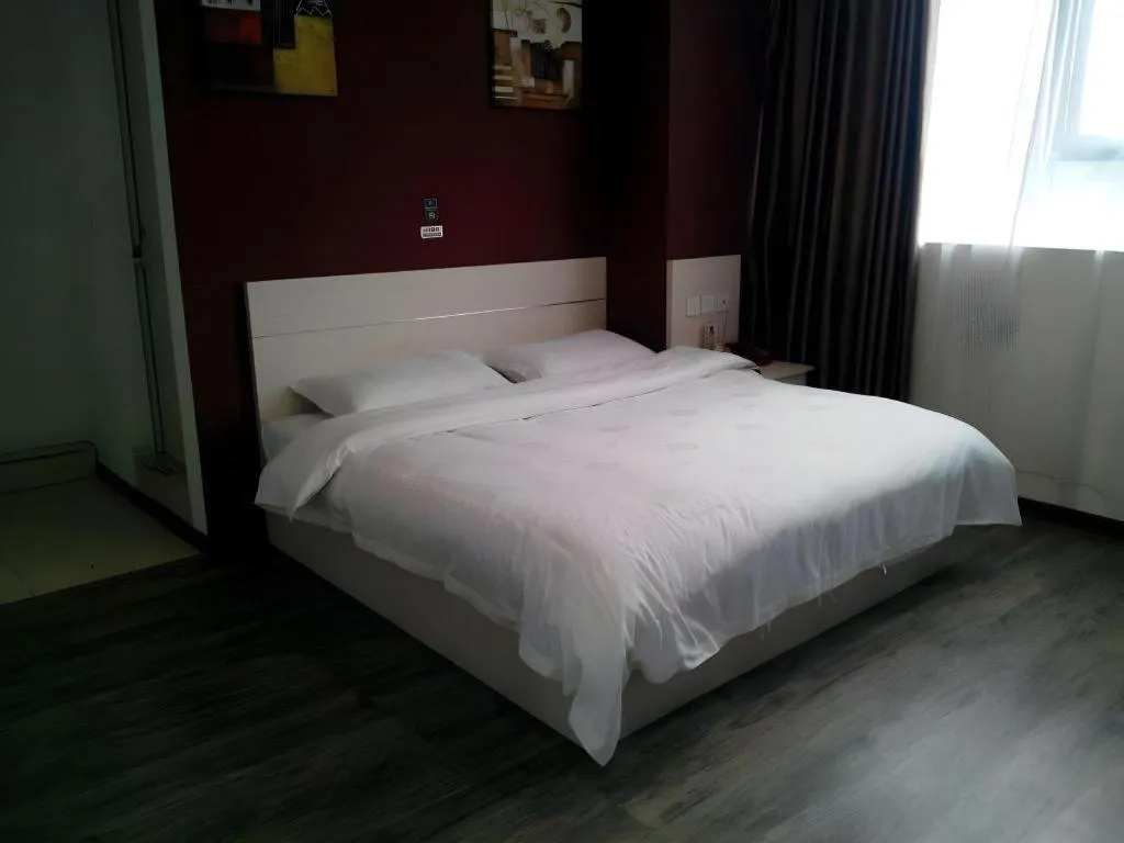 Bed in JUNYI Hotel Jiangxi Xinyu Baoshi Park