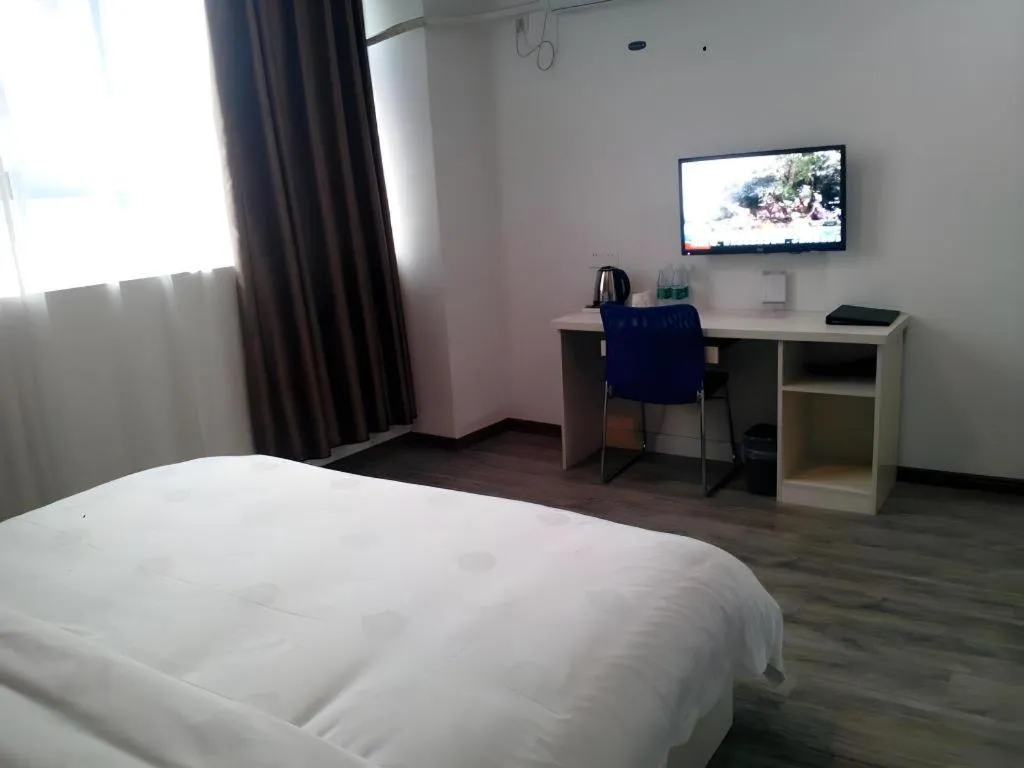 Bed in JUNYI Hotel Jiangxi Xinyu Baoshi Park