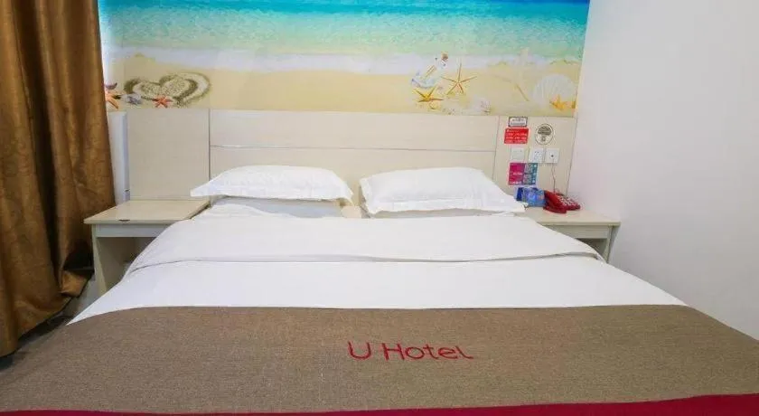 Bed in JUNYI Hotel Jiangxi Xinyu Baoshi Park