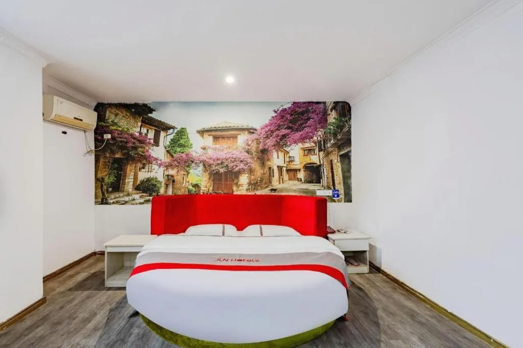 Bed in JUNYI Hotel Jiangxi Xinyu Baoshi Park