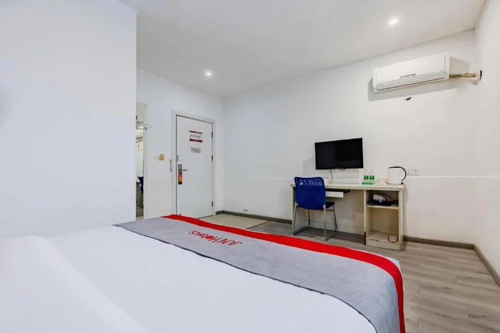 Bed in JUNYI Hotel Jiangxi Xinyu Baoshi Park