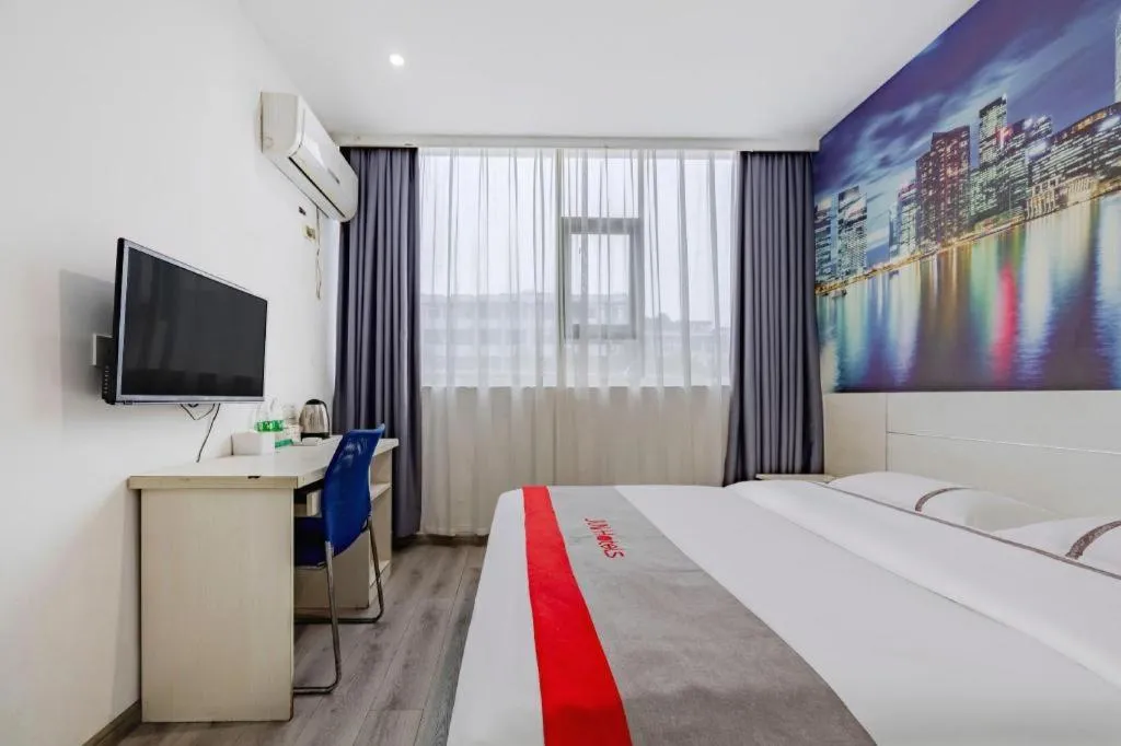 Bed in JUNYI Hotel Jiangxi Xinyu Baoshi Park