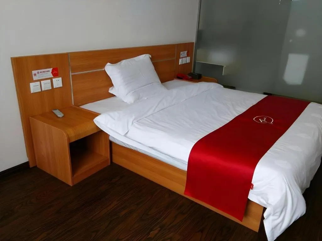 Bed in JUNYI Hotel Jiangxi Xinyu Baoshi Park