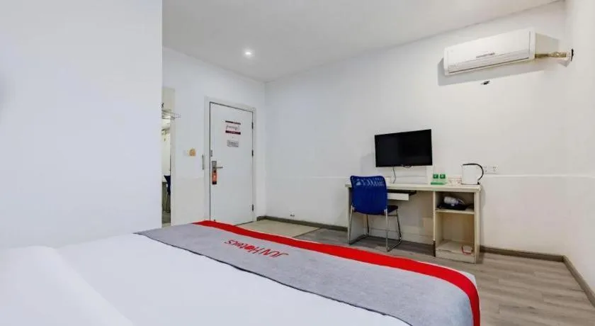 Bed in JUNYI Hotel Jiangxi Xinyu Baoshi Park