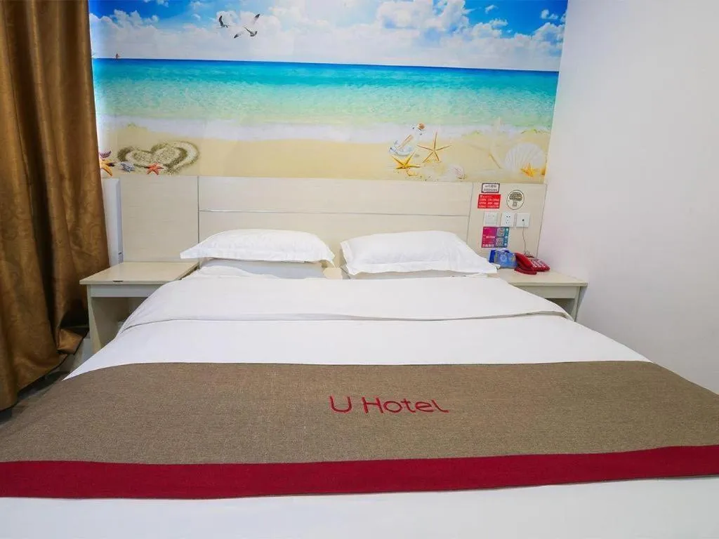 Bed in JUNYI Hotel Jiangxi Xinyu Baoshi Park