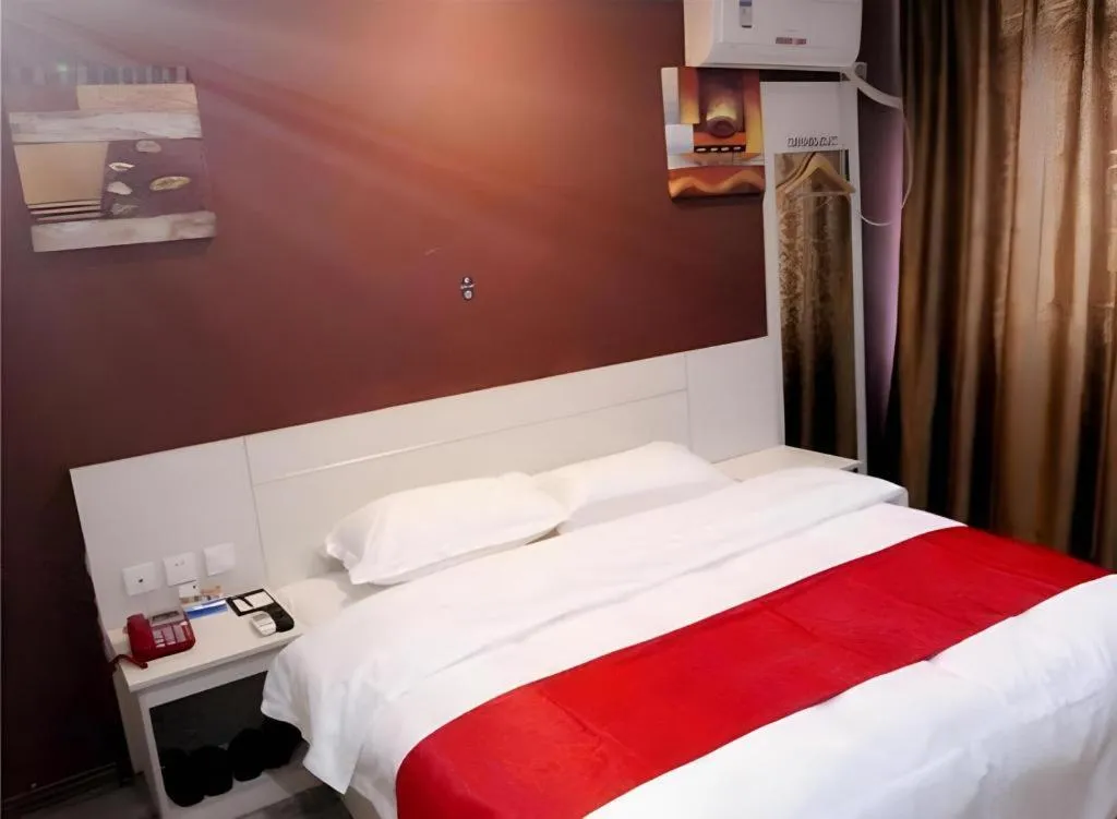 Bed in JUNYI Hotel Jiangxi Xinyu Baoshi Park