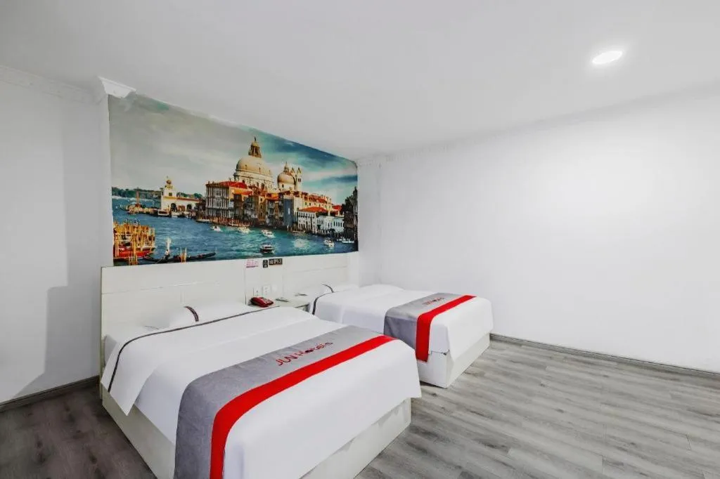 Bed in JUNYI Hotel Jiangxi Xinyu Baoshi Park