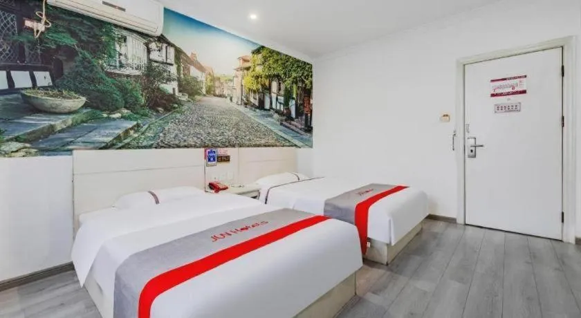 Bed in JUNYI Hotel Jiangxi Xinyu Baoshi Park