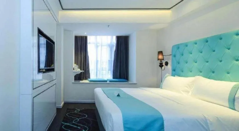 Bed in Xana Hotelle Chongqing Jiefangbei Center Branch