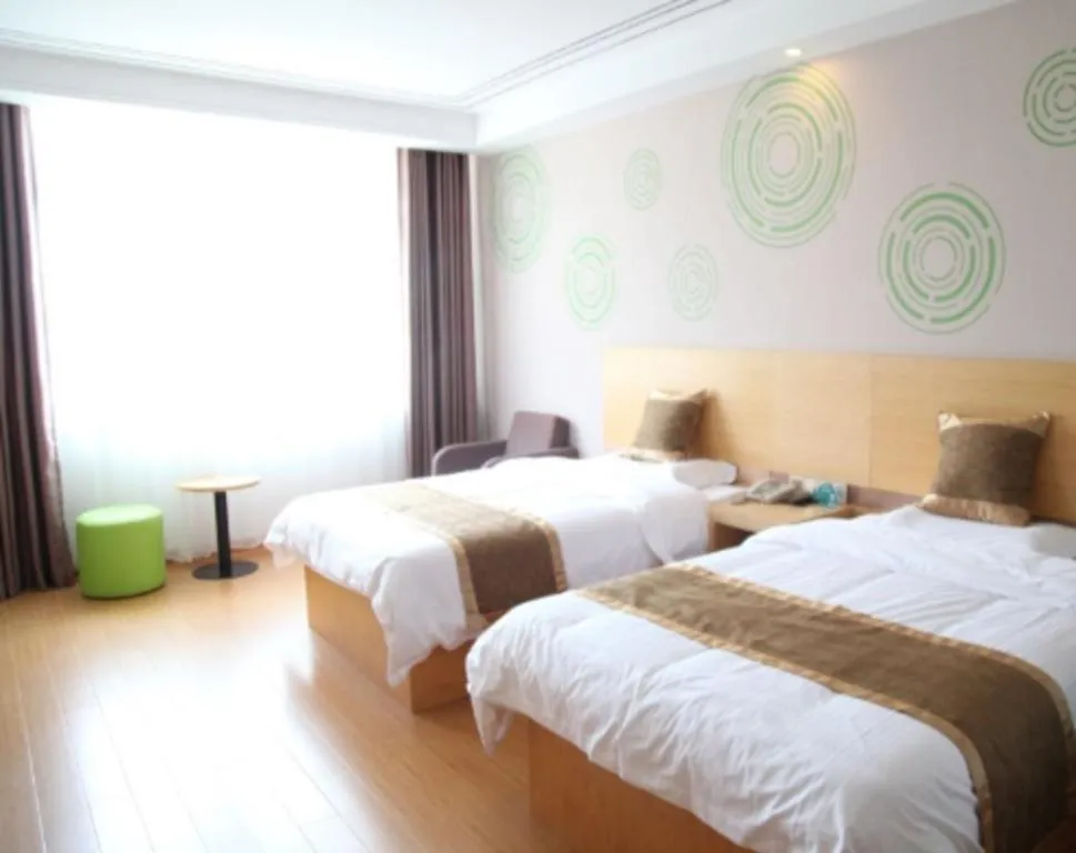 Bed in GreenTree Inn Shandong Heze Caoxian Zhuangzhai Town Oriental Times City Business Hotel