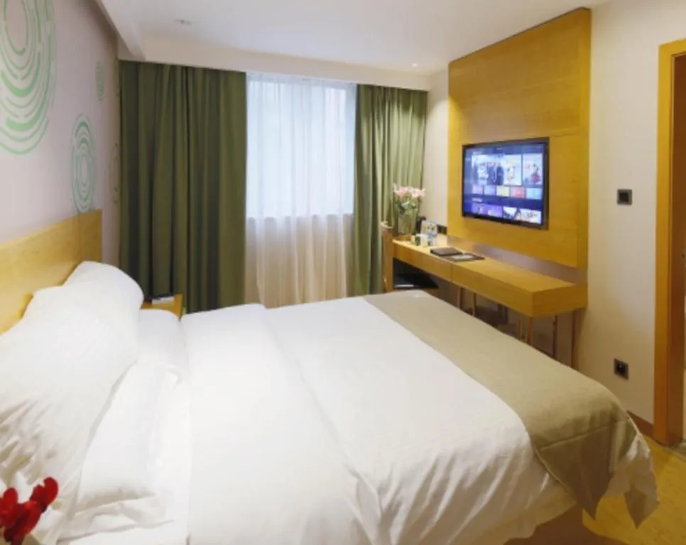 Bed in GreenTree Inn Shandong Heze Caoxian Zhuangzhai Town Oriental Times City Business Hotel