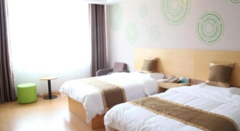 Bed in GreenTree Inn Shandong Heze Caoxian Zhuangzhai Town Oriental Times City Business Hotel