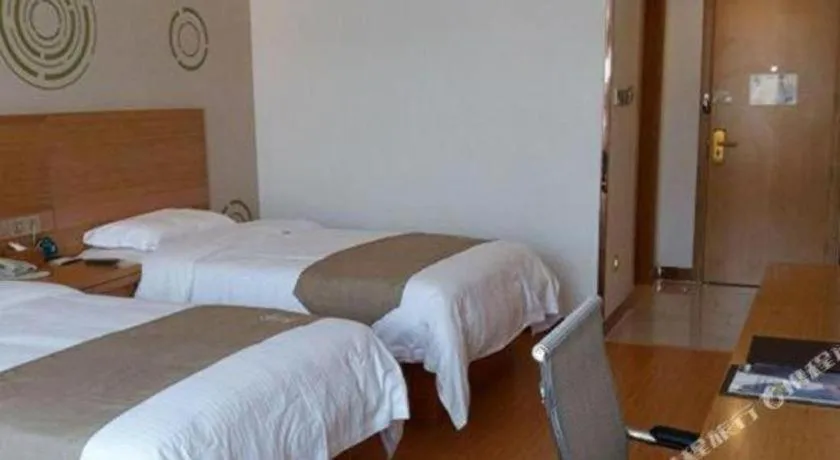 Bed in GreenTree Inn Shandong Heze Caoxian Zhuangzhai Town Oriental Times City Business Hotel