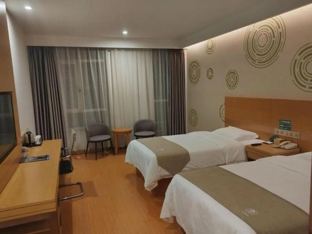 Bed in GreenTree Inn Shandong Heze Caoxian Zhuangzhai Town Oriental Times City Business Hotel