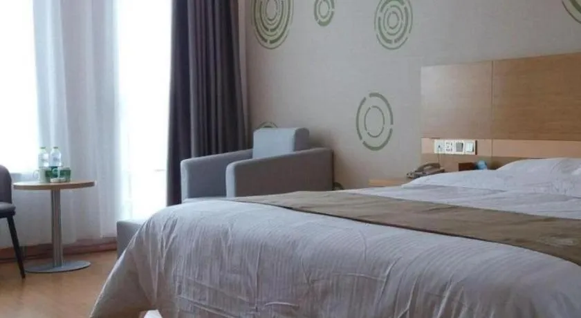 Bed in GreenTree Inn Shandong Heze Caoxian Zhuangzhai Town Oriental Times City Business Hotel